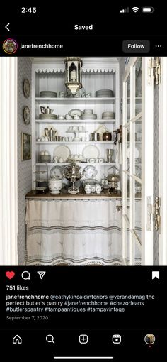 an old fashioned china cabinet with dishes on it