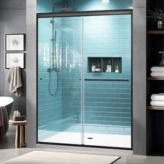 a bathroom with a walk in shower next to a bath tub