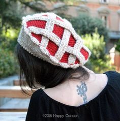 a woman wearing a red and white knitted hat