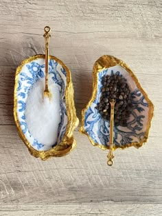 two blue and white dishes with spoons in them