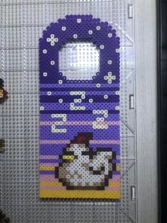 an image of a cell phone case made out of legos and plastic beads with a chicken on it