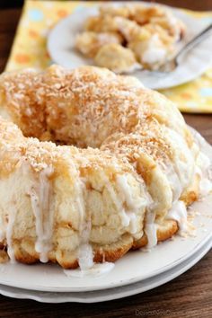 a white plate topped with a donut covered in frosting