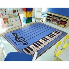 a blue area rug with musical notes on it in a child's playroom