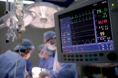 medical personnel performing surgery in an operating room