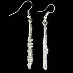 silver earrings with crystal beads on black background