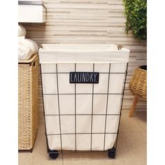 a laundry basket sitting on top of a tiled floor