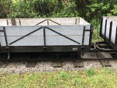 an old train cart sitting on the tracks