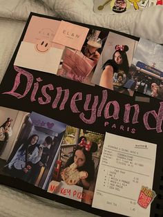 the disneyland paris book is laying on a bed