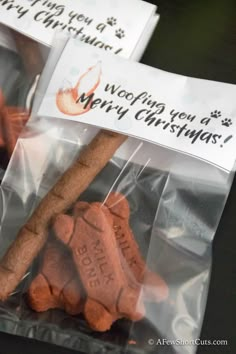 two bags filled with dog treats sitting on top of a table