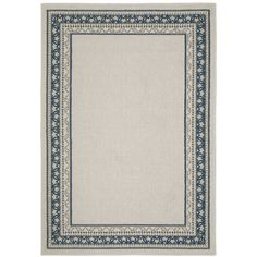 a beige rug with blue border