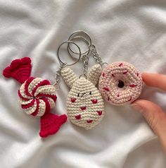 two crocheted keychains that look like donuts