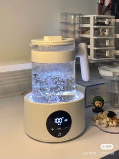 a blender sitting on top of a counter next to a box of cereals