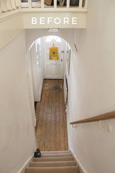 the stairs lead up to an entry way with a yellow sign above it that says before