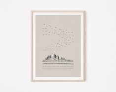 birds flying in the sky over a cityscape with trees and buildings on it