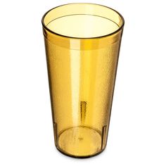 a gold colored glass is shown against a white background