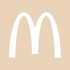 a mcdonald's logo is shown in white on a beige background with the words,