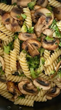 pasta with mushrooms and broccoli in a pan