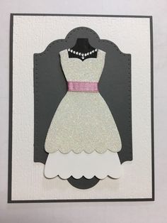 a card with a dress on it