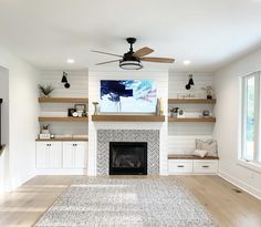 the living room is clean and ready to be used as an entertainment area with built - in shelving