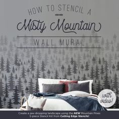 a bedroom with a mountain mural on the wall behind it and a bed in front of it