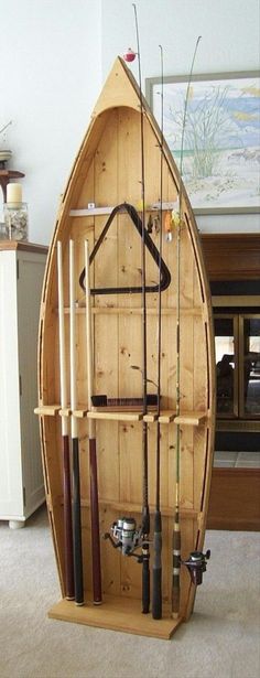 a boat made out of wooden planks and fishing rods