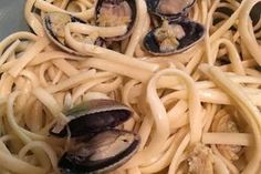 pasta with clams and sauce in a pan