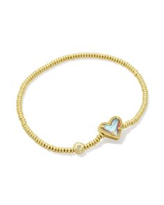 An easy addition to any wrist stack, meet the Ari Heart Gold Stretch Bracelet in Dichroic Glass. Our iconic sweet heart shape meets the versatile stretch bracelet style, perfect for adding a casual but cute pop of color to your look. The best part? It’s designed to fit any wrist. Metal 14k Yellow Gold Over Brass Material Dichroic Glass Closure Stretch Bracelet Size 6.5" Unstretched Circumference, 0.43"L X 0.37"W StationDue to the one-of-a-kind nature of the medium, exact colors and patterns may vary slightly from the image shown. | Kendra Scott Ari Heart Gold Stretch Bracelet in | Dichroic Glass Kenra Scott Bracelet, Gold Stretch Bracelet, Kendra Scott Bracelet, Wrist Stacks, Preppy Jewelry, Sorority Gifts, Bracelet Style, Jewelry Lookbook, Sweet Heart