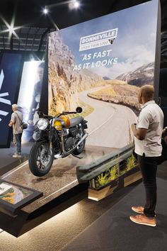 Custom exhibition stand for Triumph Motorcycles, featuring a series of themed motorbike displays. Motorcycle Exhibition Design, Automotive Showroom, Harley Davidson Store, Motorcycle Stand, Photo Booth Design, Exhibition Stall Design, Stage Set Design, Exhibition Stall, Stall Designs