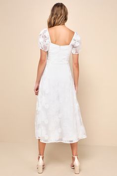 Head out the door looking peachy keen and perfect in the Lulus Sweetest Behavior White Embroidered Puff Sleeve Midi Dress! Bold and beautiful floral embroidery adorns airy woven organza-like fabric as it shapes short puff sleeves and a princess-seamed bodice with a sweetheart neckline. High, fitted waist sits atop a flowy A-line skirt that falls to a midi hem. Hidden back zipper/clasp. Fit: This garment fits true to size. Length: Mid-calf length. Size medium measures 47.5" from shoulder to hem. Puff Sleeve Dress With Floral Embroidery For Garden Party, White Dress With Sleeves, White Dresses Graduation, Puff Sleeve Midi Dress, Rehearsal Dinner Dresses, Peachy Keen, Dress With Sleeves, Embroidered Midi Dress, Rehearsal Dress