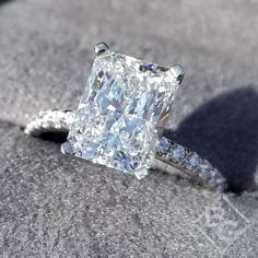 an engagement ring with a cushion cut diamond