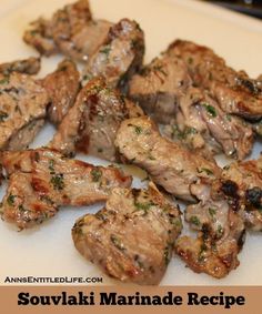 grilled meat with herbs on it sitting on a plate