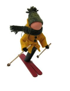 a stuffed animal is riding skis on a white background