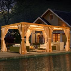 a gazebo sitting next to a body of water in front of a house at night