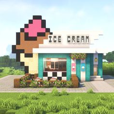 a small ice cream shop in the middle of a green field with trees and bushes