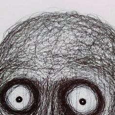 a drawing of two eyes with hair on them