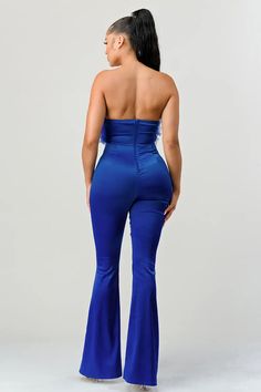 Introducing the highly coveted Royal Blue Satin Ruffled Front Jumpsuit. Sumptuous satin, this irrepressibly elegant piece is sure to be the statement-making piece for any occasion. Featuring a ruffled front for eye-catching detail, it has been designed with stretch for an unbeatable fit. Indulge in luxury and make a dazzling impression with this must-have jumpsuit. Royal blue Stretch Satin Chiffon Ruffled front Off shoulder Self: 96% Polyester 4% Spandex Contrast:100% Polyester Solid Satin Jumpsuits And Rompers For Night Out, Chic Blue Satin Bottoms, Glamorous Satin Jumpsuits And Rompers For Spring, Glamorous Spring Satin Jumpsuit, Spring Party Satin Jumpsuits And Rompers, Satin Jumpsuits And Rompers For Spring Party, Chic Fitted Satin Jumpsuits And Rompers, Glamorous Ruffled Jumpsuits For Night Out, Glamorous Ruffled Jumpsuits And Rompers For Night Out