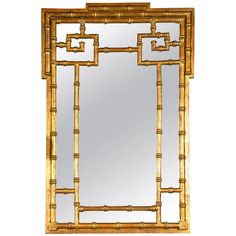 a mirror that is made out of wood and has an intricate design on the frame