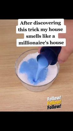 someone is pouring something into a bowl with blue liquid in it and the words, after discovering this trick my house smells like a million dollar's house