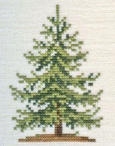 a cross stitch picture of a pine tree