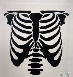 a black and white drawing of a skeleton with the rib cage on it's chest