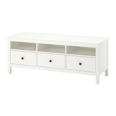 a white tv stand with drawers on it