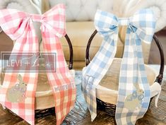 two baskets with bows are sitting on a table