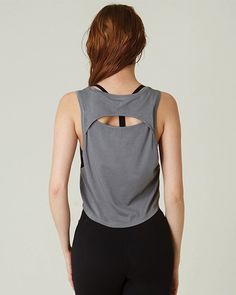 Our take on a easy to wear muscle tank that takes you to and from practice. The slightly lower armholes and keyhole at the back keeps you cooler during your workouts. Layer over sports bras and complete the look with leggings and shorts. A wardrobe staple that is made in soft pima cotton, cool to touch modal, and a hint of stretch for ultimate comfort and style. Biocompact finish keeps the fabric long lasting and smooth. Machine Wash Model is 5'9" wearing size S Sporty Tank Top With Built-in Bra For Yoga, Black Sporty Activewear With Scoop Back, Sporty Scoop Neck Tops For Pilates, Scoop Neck Athleisure Tops For Pilates, Gray Sporty Sports Bra For Summer, Workout Seamless Tank Top With Scoop Back, Seamless Scoop Neck Activewear For Workout, Sporty Scoop Neck Activewear For Yoga, Sporty Scoop Neck Yoga Activewear