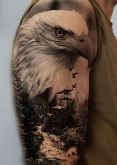 an eagle is shown on the arm with trees and birds in the sky behind it