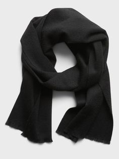 Soft and warm, this warm wool scarf is designed to be worn for more formal occasions.  Length: 70" (177. 8cm) Width: 12" (30. 5cm) Casual Solid Shawl For Winter, Casual Solid Winter Shawl, Classic Wool Scarves For Fall, Classic Wool Scarves For Cold Weather, Casual Black Wool Scarf, Elegant Solid Color Winter Scarves, Classic Scarves For Cold Weather In Fall, Classic Scarves For Fall And Cold Weather, Elegant Wool Scarves For Cold Weather