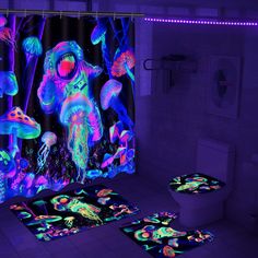 the bathroom is decorated in neon colors and features an underwater scene with jellyfishs