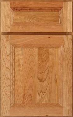 a wooden cabinet door with two drawers