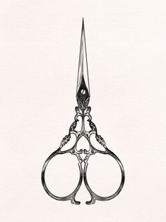 a black and white drawing of a pair of scissors with ornate designs on the handles