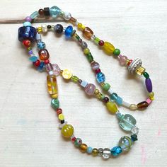 One Of A Kind Handmade Glass Bead Necklace With Vintage Y2k + 90s Beads Featuring: Vintage, Y2k/90s + Modern Beads Glass, Wood, Clay, Vinyl/Acrylic, Ceramic Curated Blend Of Small + Med-Small Beads Chunk Scale Of 1 To 5: 2.5 Fine Quality Knotted Durable High Tenacity Nylon Cord 13” Drop Length 26” Total Length Brand: Www.Karlymortensen.Com Vintage + New Materials Handmade In Denver, Colorado Ready To Ship Shop My Boutique For All Handmade Artist Items From My Studio Y2k Bead Necklace, Lamp Work Bead Jewelry, Chunky Glass Bead Necklace, Festival Beaded Necklaces With Large Glass Beads, Everyday Handmade Glass Necklaces, Handmade Colorful Glass Beaded Necklaces, Festival Glass Beaded Necklaces With Spacer Beads, Colorful Handmade Glass Beaded Necklaces, Festival Glass Beaded Necklace With Spacer Beads