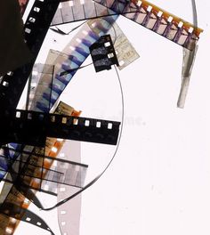 an abstract photograph with film strips and other things in the foreground, against a white background